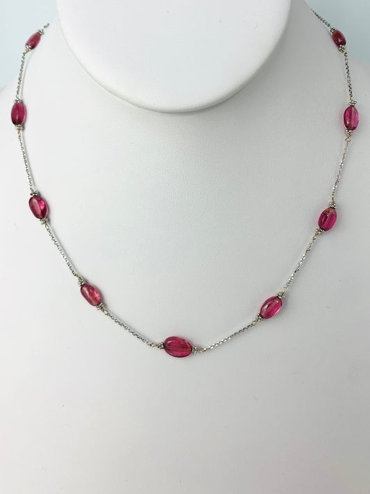 pink tourmaline oval smooth beads wrapped with white gold rondelle accents in 11 stations around a 14k white gold chain