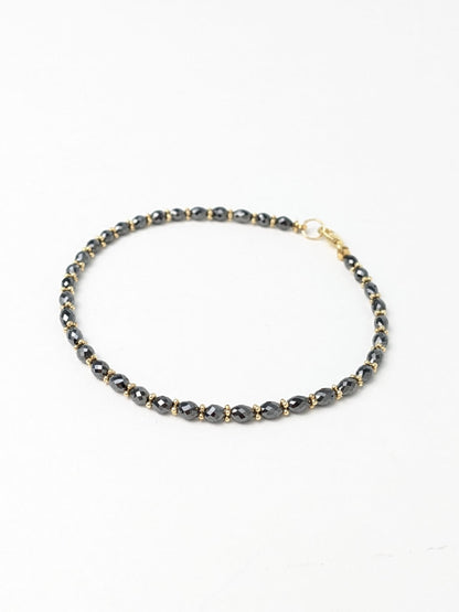 Black Diamond Oval Bracelet with Rondelle Accents in 14K Gold